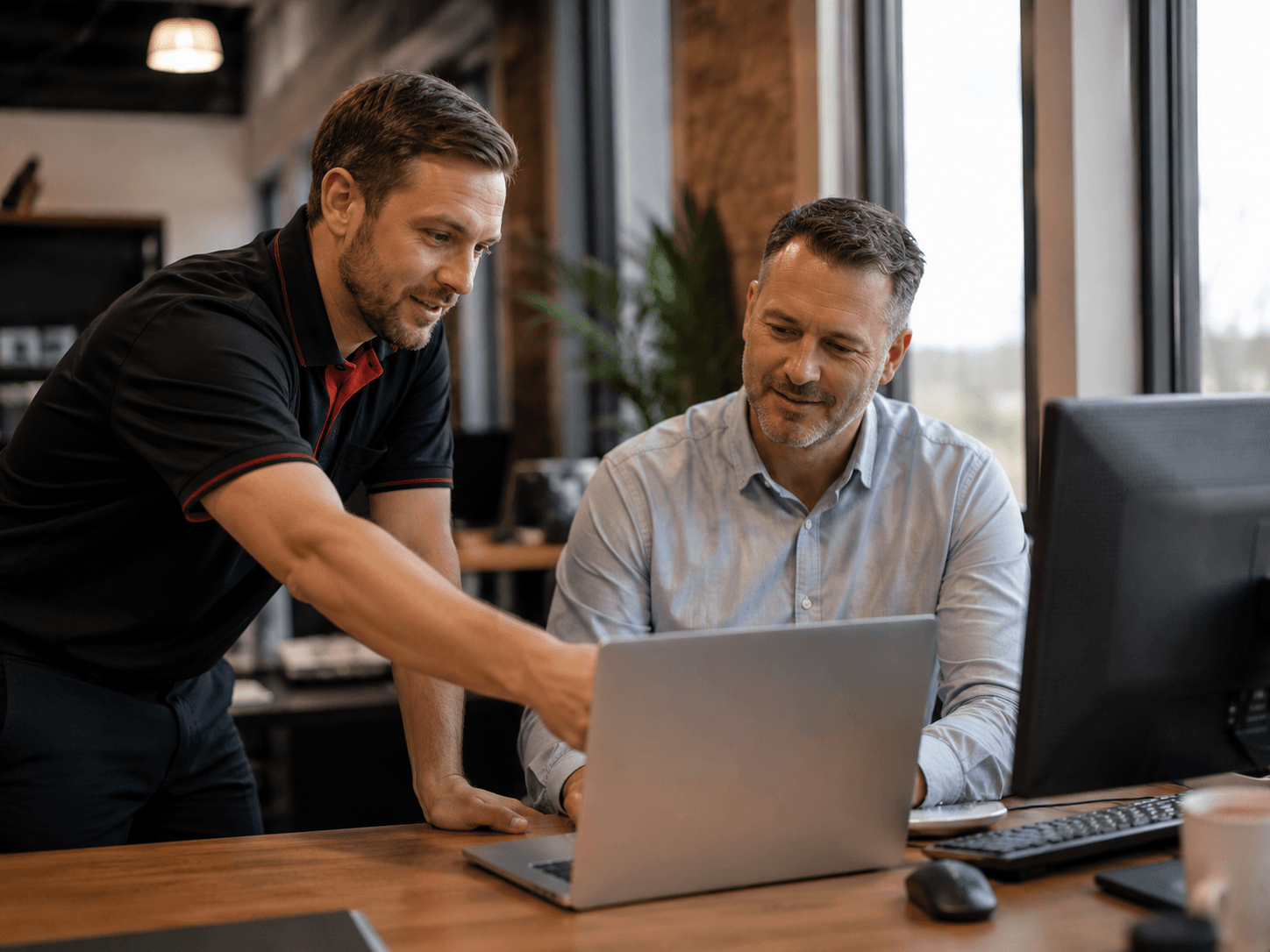 IT technician helping a Christchurch business owner — Veltech on-site support